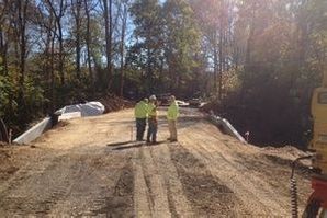 Three men, dirt road